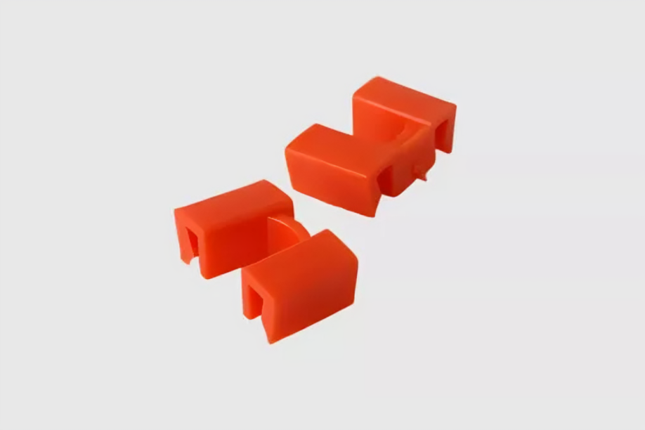 Red plastic clips on white background