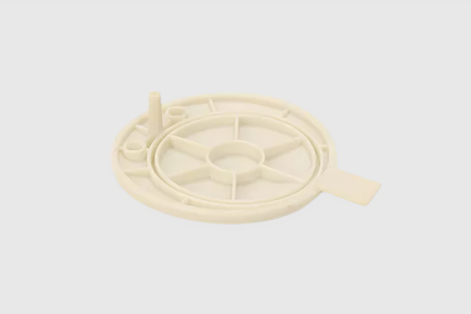 White plastic circular part for machinery