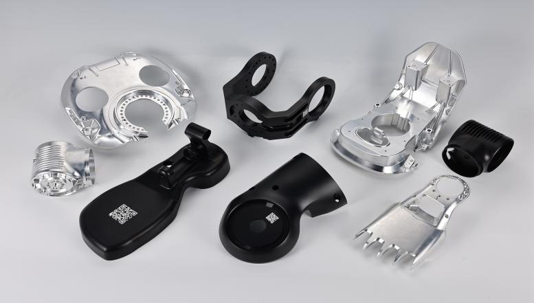 Assorted precision machined metal components on display