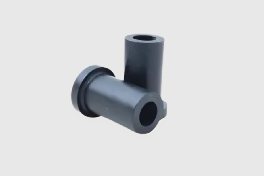 Black plastic connector pipe on white background.