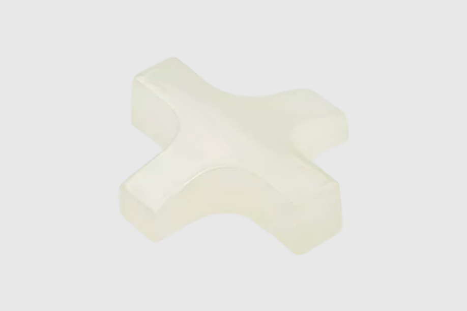White ceramic tile spacer, four-legged shape