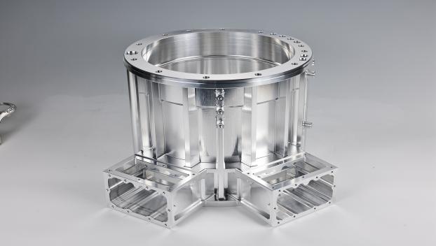 Industrial aluminum component with circular opening.