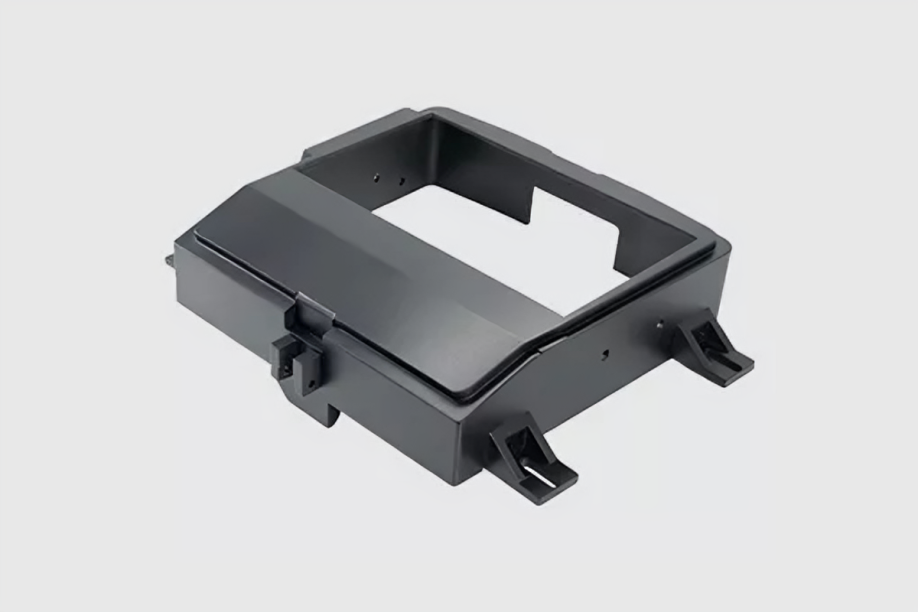 Black plastic bracket with mounting features