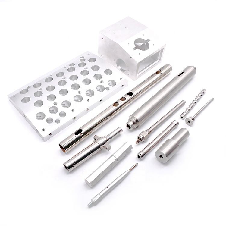 Various industrial metal components on white background.