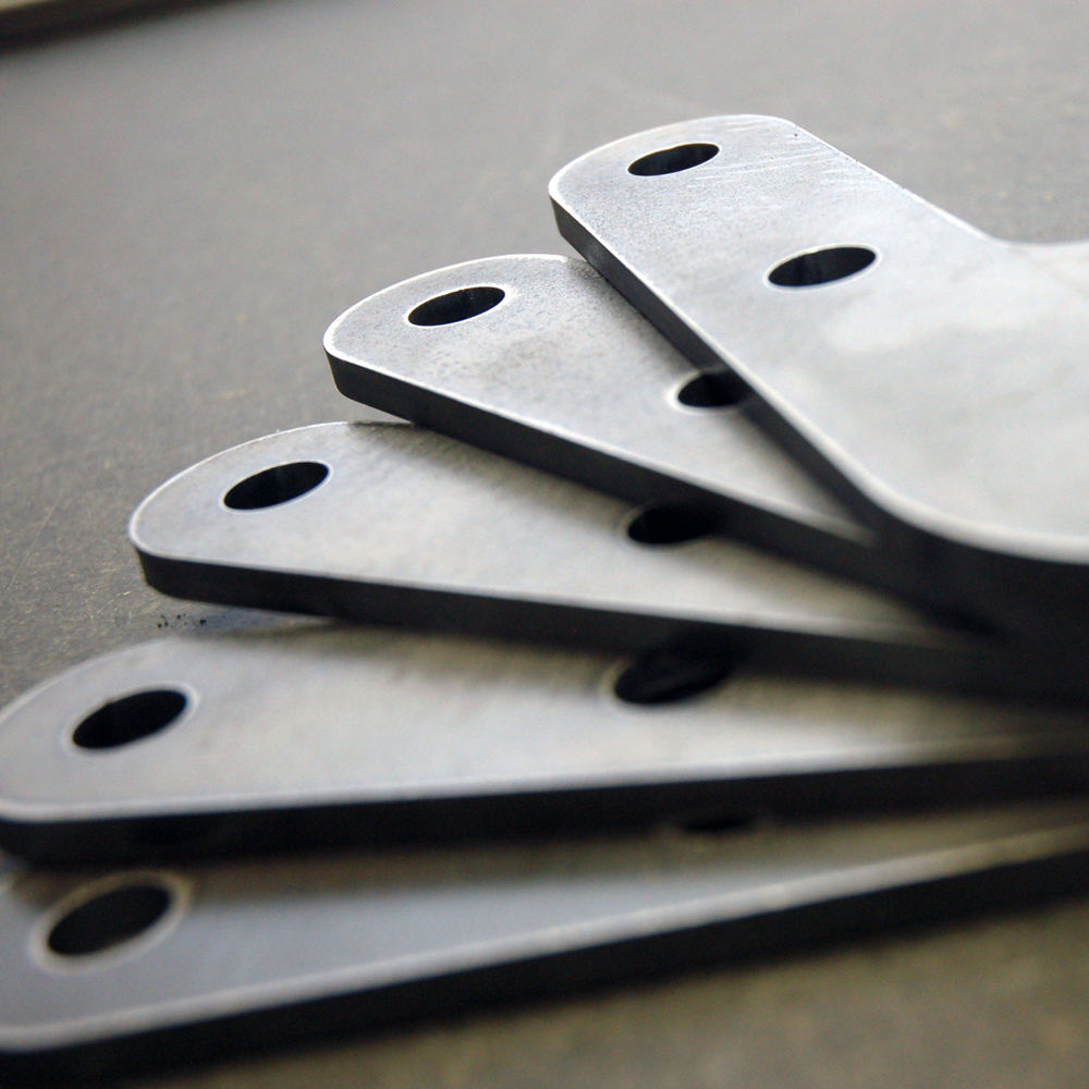 Stack of metal brackets with holes