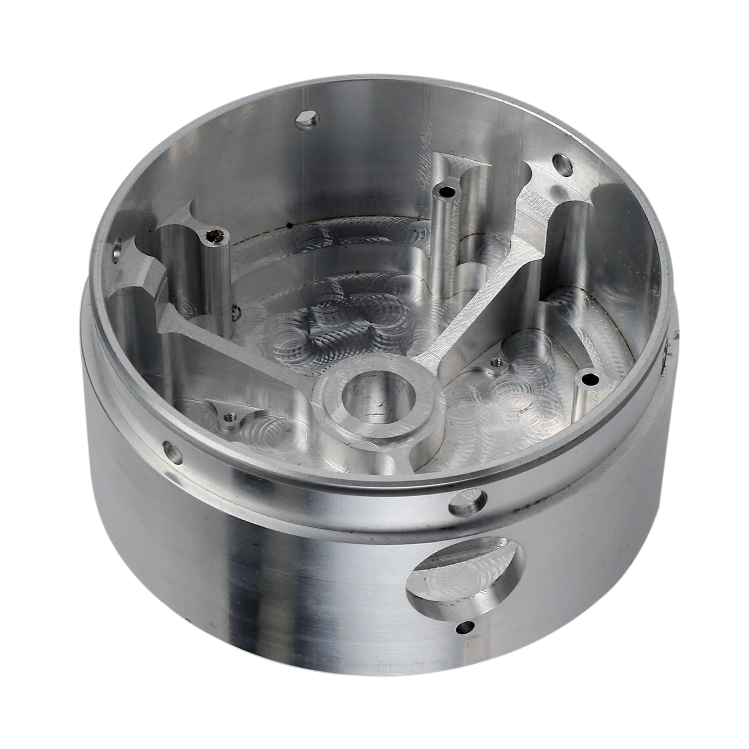 CNC machined metallic circular component with detailed design.