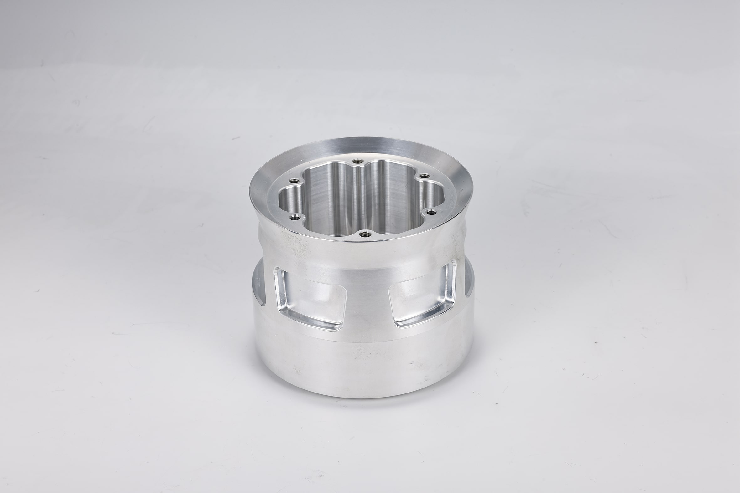 Aluminum machined part with multiple openings.