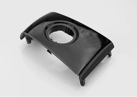Black plastic automotive engine cover component