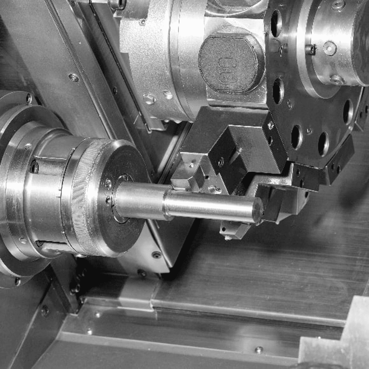 Lathe machine operating in a manufacturing facility.