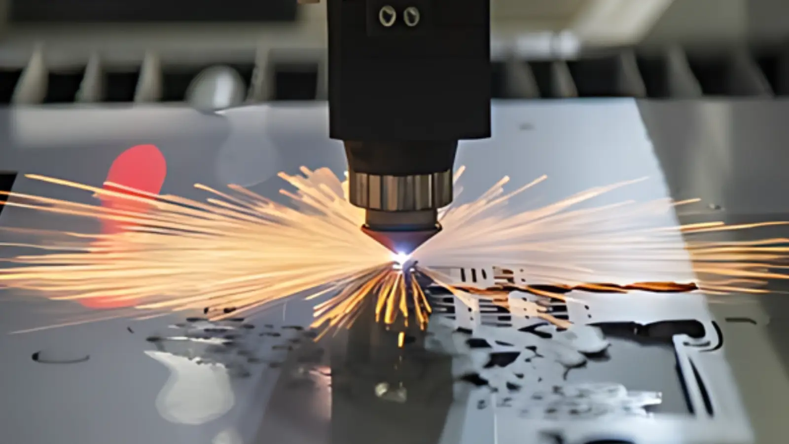 Laser cutting metal with sparks flying
