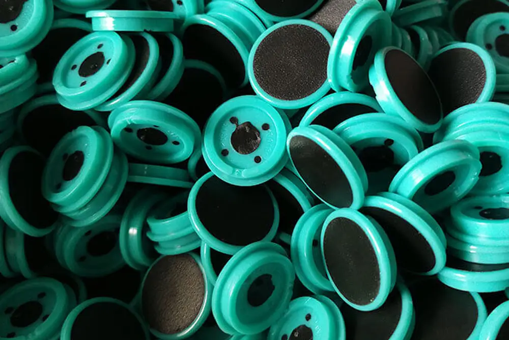 Turquoise bottle caps piled together