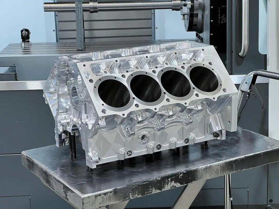 Aluminum engine block on machine table.