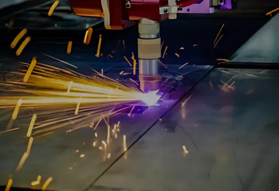 Laser cutting metal with sparks flying