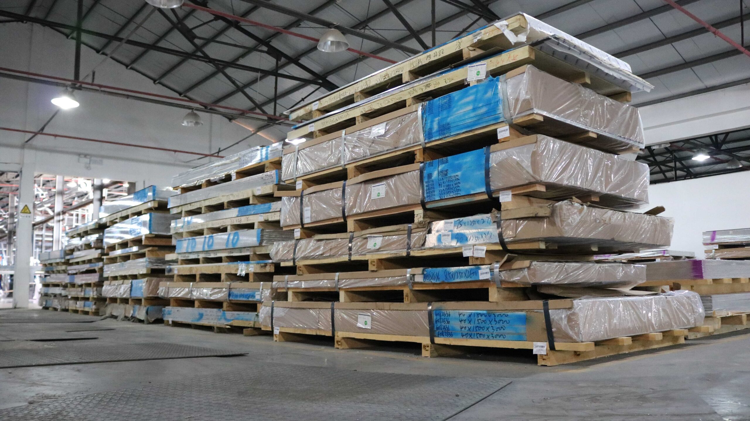 Stacked pallets in a warehouse.