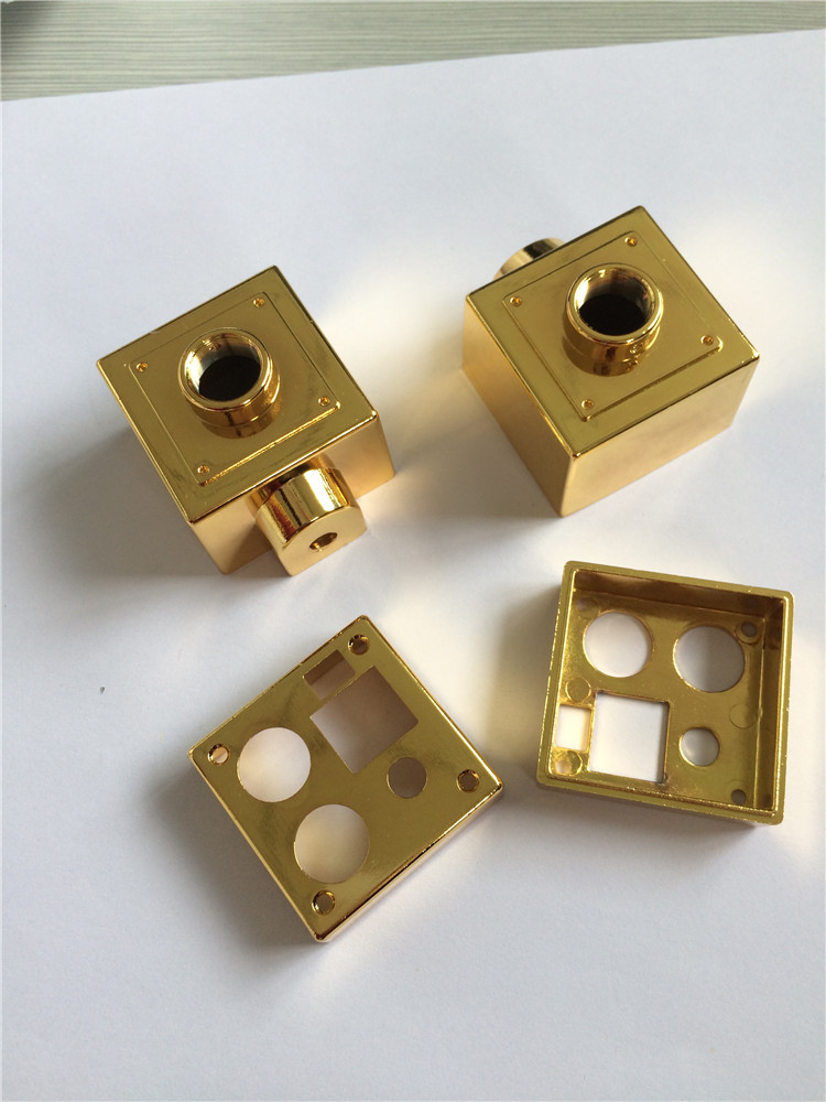 Gold-plated CNC machining parts on white background