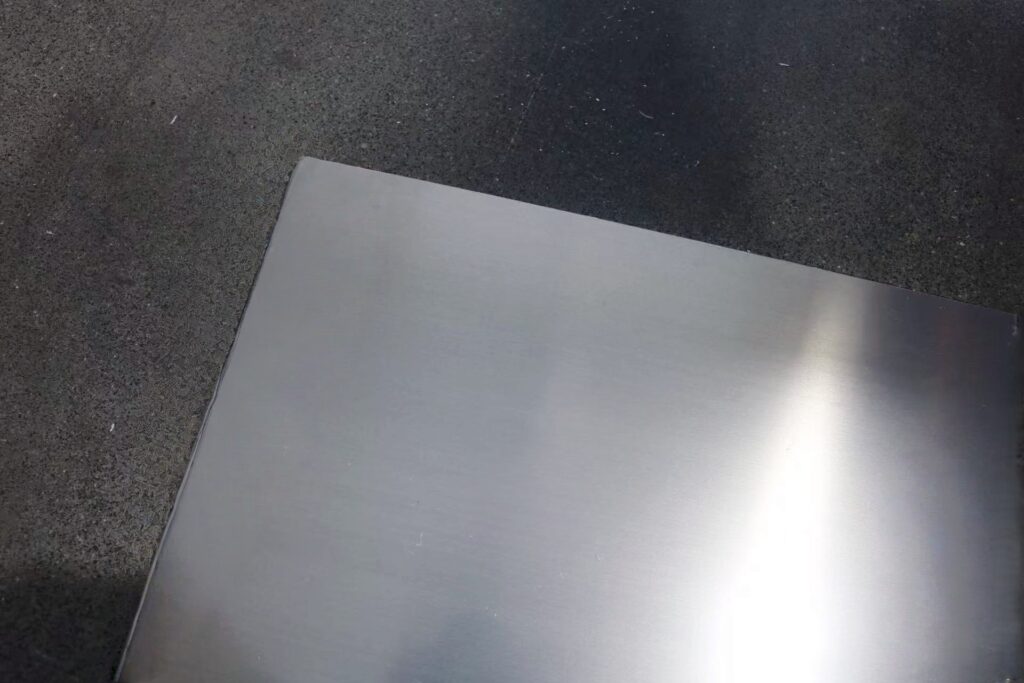 Steel sheet on dark textured surface