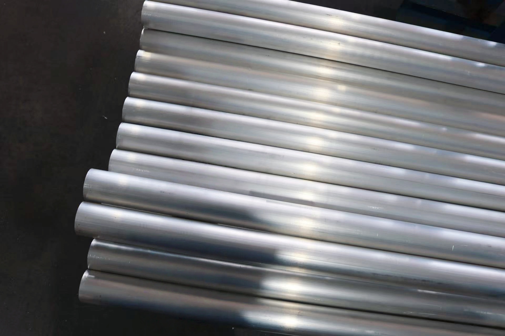 Stack of shiny metal pipes
