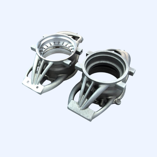 Two metallic industrial machine parts on display.