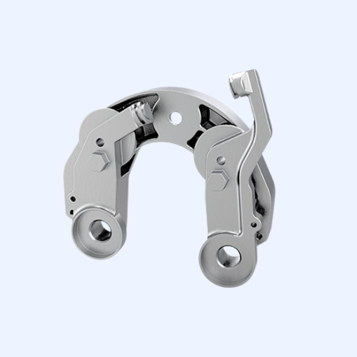 Silver mechanical gear component on white background.