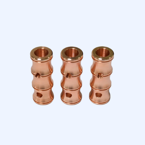 Three copper pipe fittings aligned vertically