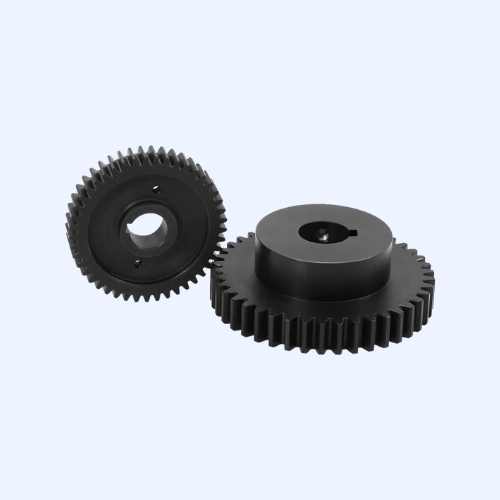 Two black machine gears on light background