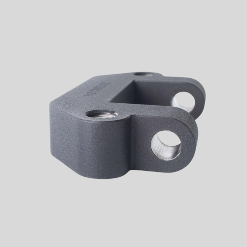 Gray metallic industrial part with two holes