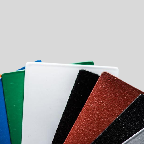 Colorful textured plastic sheets arranged in stack.