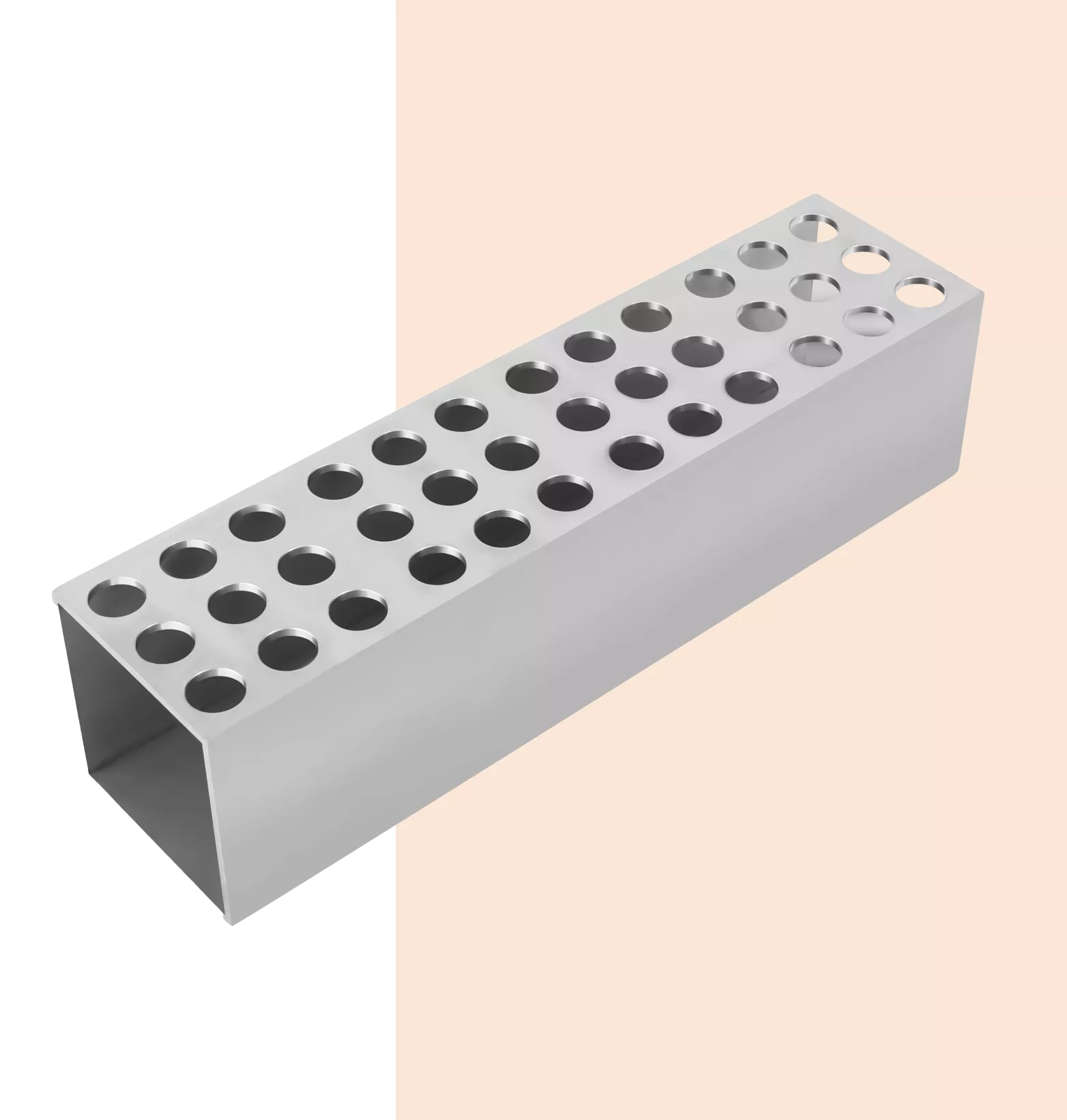 Steel perforated square pipe on beige background.