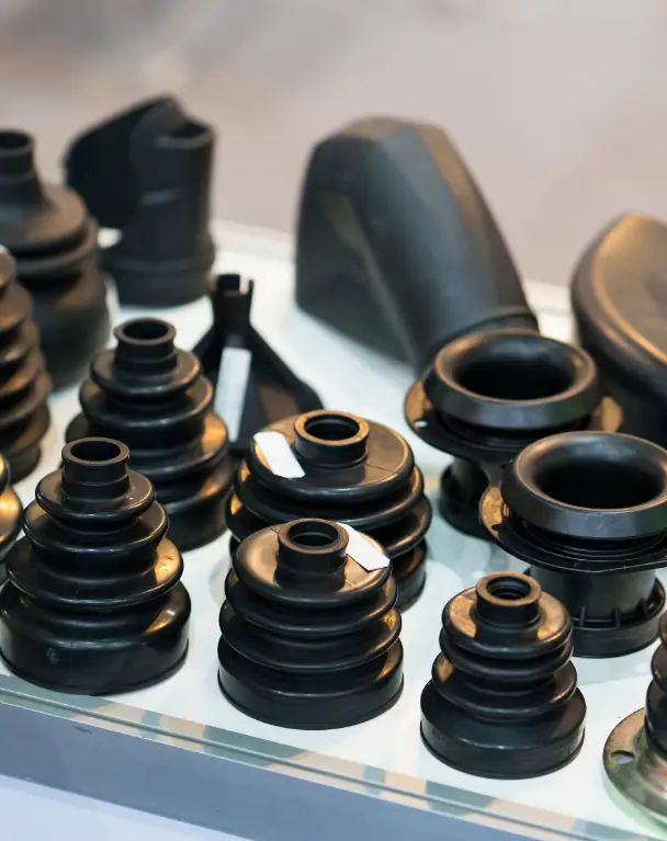 Various black rubber automotive parts displayed.