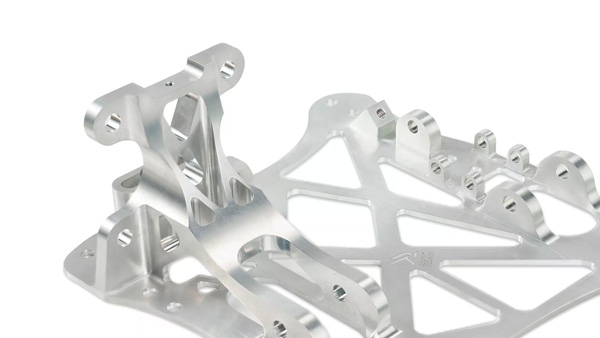Intricate CNC-machined aluminum component with complex design.