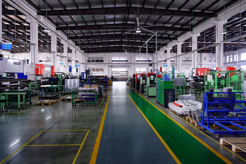 Modern factory with machinery and workstations.